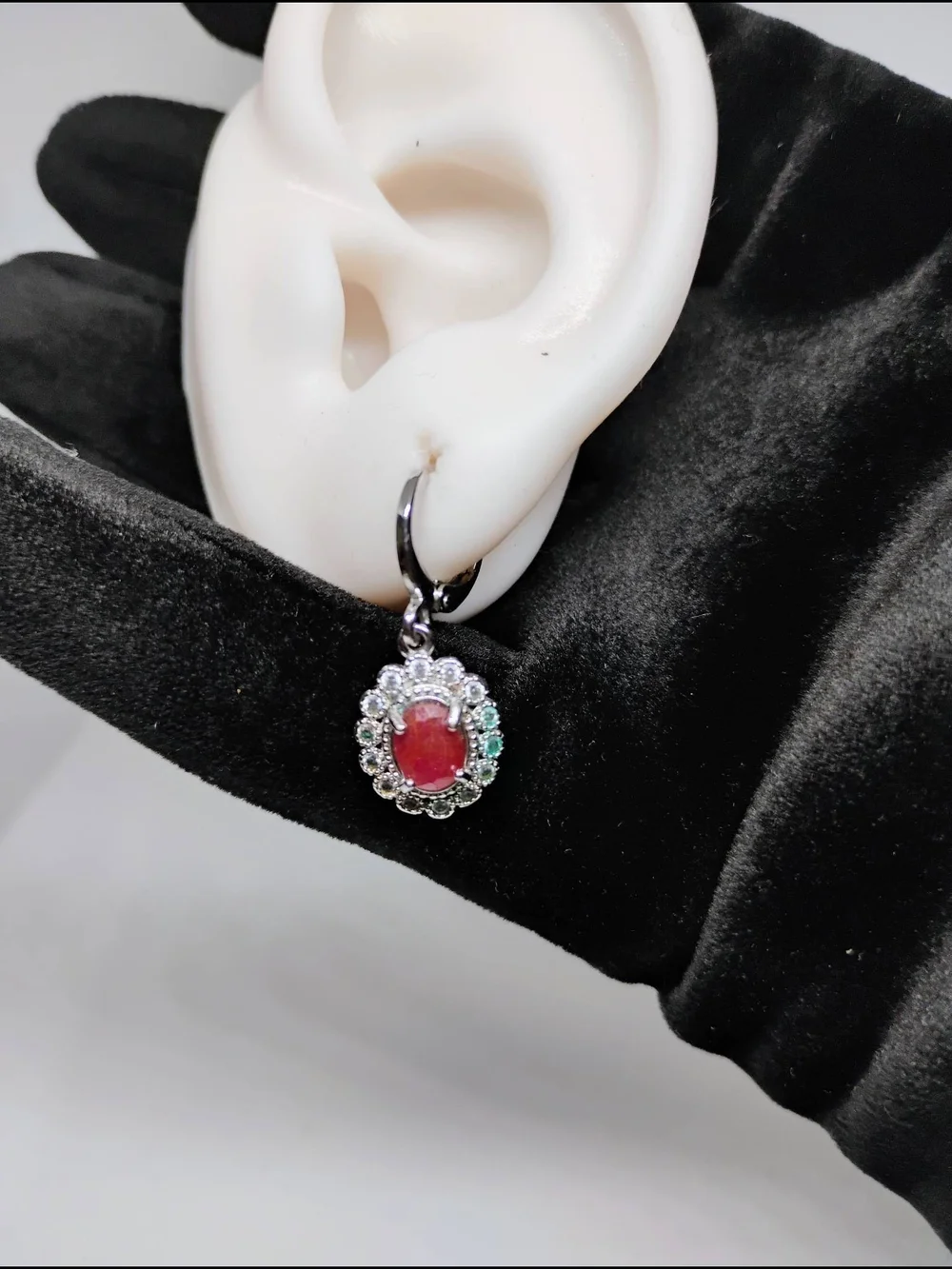 Ruby and Cuban Zirconia earrings oval gemstone surrounded by smaller clear stone